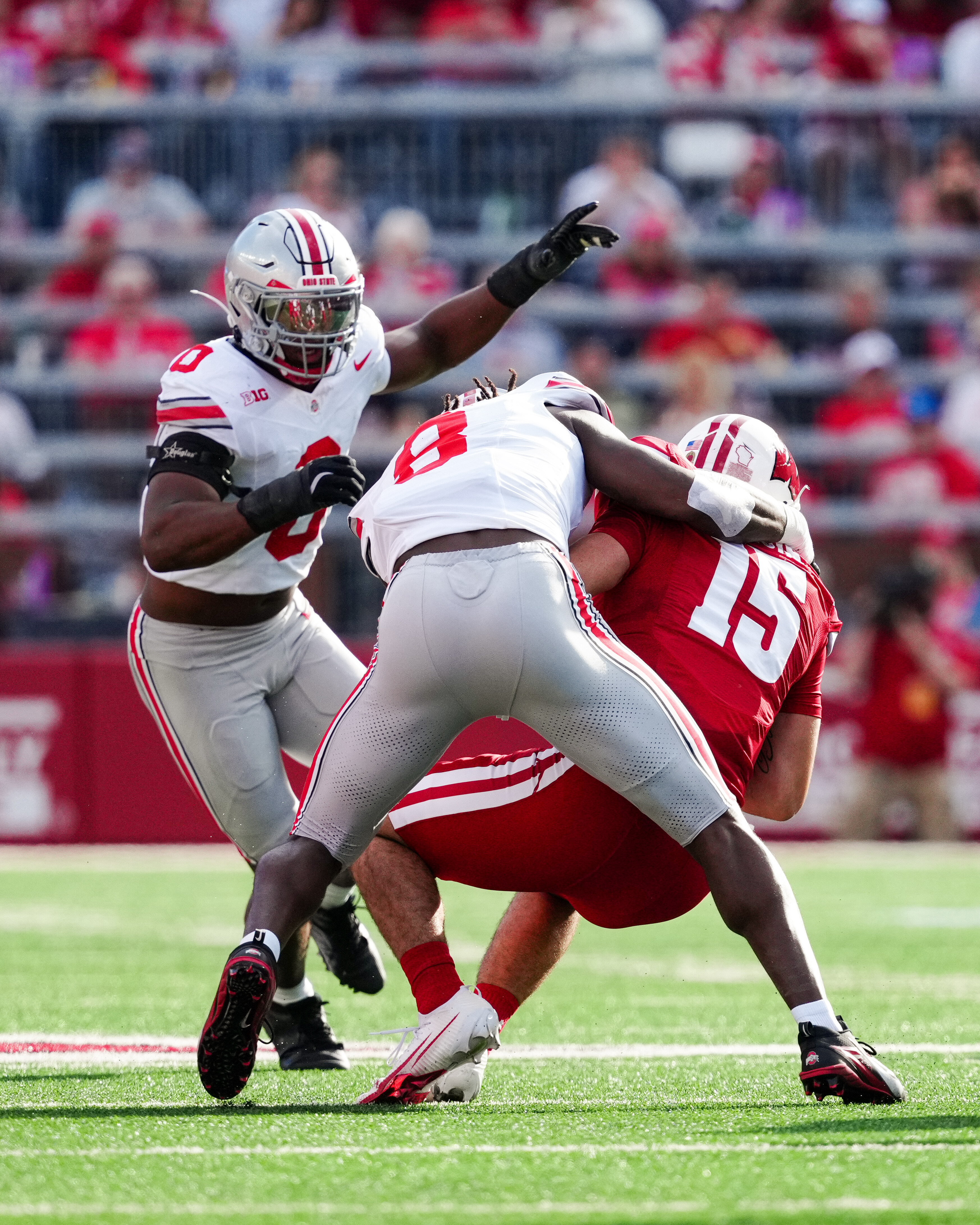 Oct 18, 2025; Madison, Wisconsin, USA; Ohio State Buckeyes linebacker Arvell Reese (8) sacks Wisconsin Badgers quarterback Hunter Simmons (15) in the first half at Camp Randall Stadium on October 18, 2025 in Madison, Wisconsin. Photography by Ross Harried for Second Crop Sports.